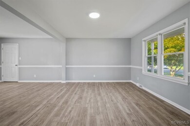 Expansive area room with new luxury vinyl plank fl