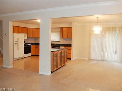 Additional view of dining room and kitchen.
