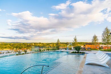 Community pool featuring fence and a patio area