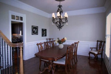 Elegant formal dining room with an easy reach to kitchen.