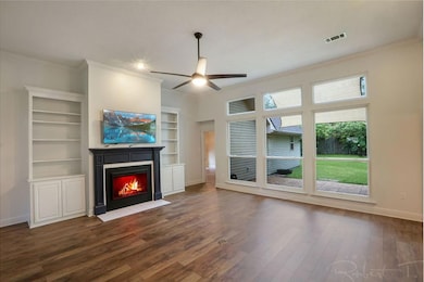 Wall of brand new Andersen windows look out to the huge yard