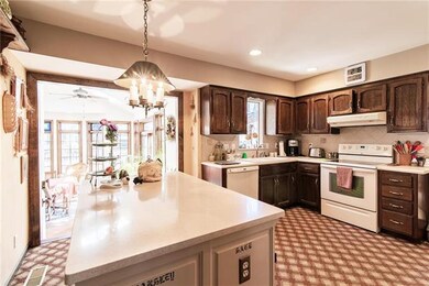 Large kitchen island overlooking the 4 season room
