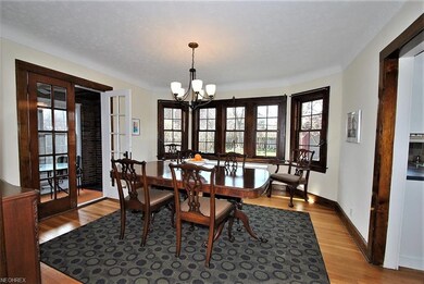 Dining room has large bay window overlooking beaut