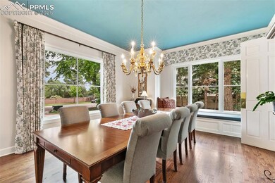 Dining area featuring custom curtains and a window seat