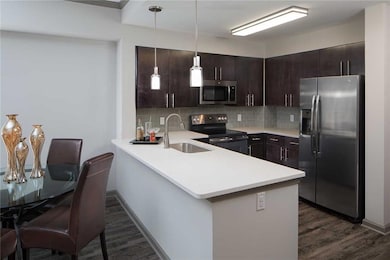 Kitchen featuring appliances with stainless steel 