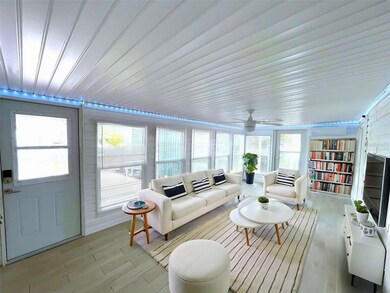 Virtually staged- enclosed sunroom/bonus room with mini split
