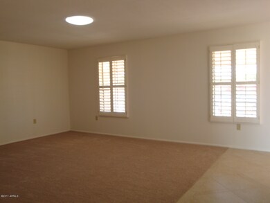 LIVING ROOM WITH PLANTATION SHUTTERS