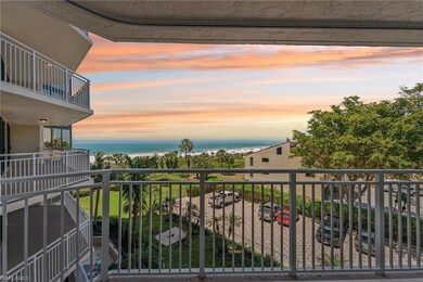 Balcony at dusk featuring a water view