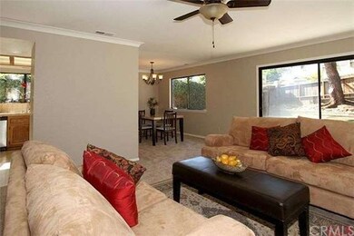Living room, dining area and kitchen have great fl