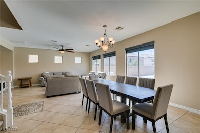 Dining space with light tile patterned floors, cei