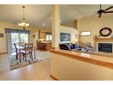 The welcoming foyer with 18 inch tile floors opens