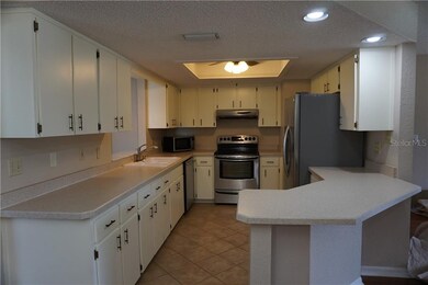 Kitchen with lots of cabinets and counter spance