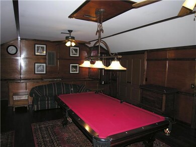 Have to love the rich wood paneling in this quiet rec room, tucked over the garage.