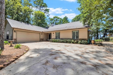 Concrete driveway leading up to the home and 2-car