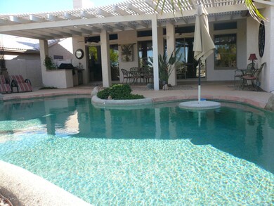 VIEW OF POOL AND FULL COVERED BACK PATIO