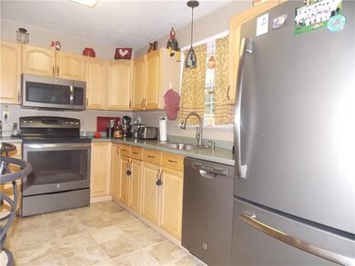 NEWER PORCELAIN FLOORS ENHANCE THIS KITCHEN EVEN M