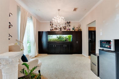 This elegant room is illuminated by a stunning cha