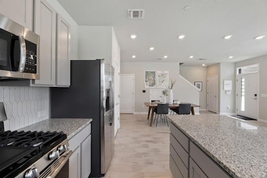Kitchen featuring appliances with stainless steel