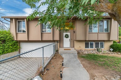 View of front of house with an attached garage, brick siding, and concrete driveway