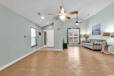 Unfurnished living room featuring ceiling fan, high vaulted ceiling, and light hardwood / wood-style floors