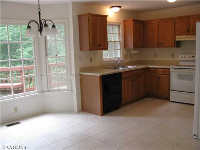 Kitchen - Ceramic tile floors, bay window.