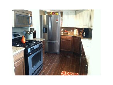 Kitchen. New Tile flooring, cabinets with soft clo