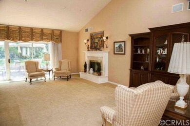Spacious living room with a fireplace, built in sh