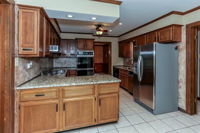 Open kitchen with granite, plenty of counter space