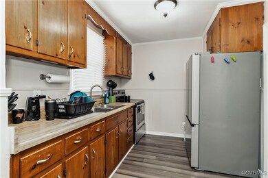 Kitchen with wood walls, appliances with stainless