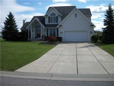 Exterior Front. Concrete driveway that can accomod
