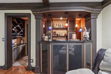 Custom built dry bar in the family room with penda