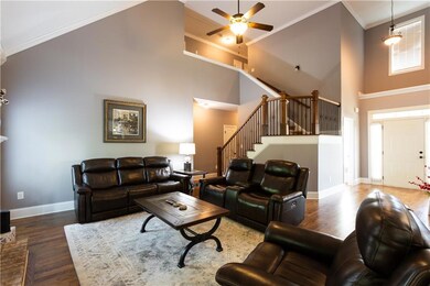 Living room featuring ornamental molding, a ceilin