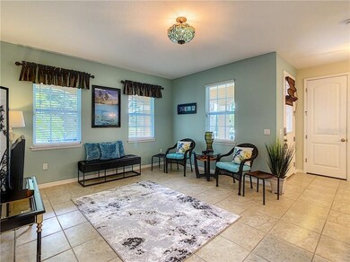 Well lit Living Room adjoining the front porch ove
