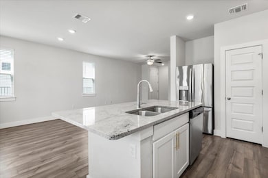 Kitchen with a sink, dishwasher, ceiling fan, dar