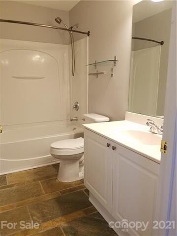 custom stone flooring in owner bath w/garden tub