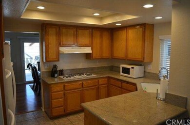 Kitchen with view of formal dining area and slider