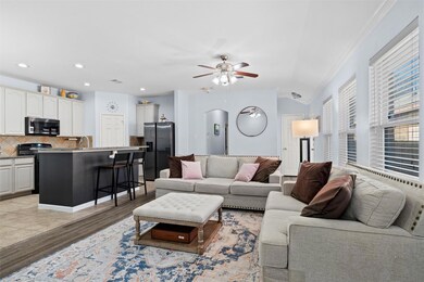 Living room with vaulted ceiling, ceiling fan, cro