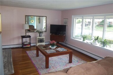 Formal Living room with hardwood floors and bay wi