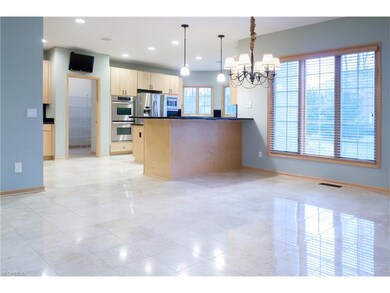 Eat-in kitchen with marble floors throughout