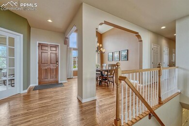 Foyer featuring light wood-style floors, plenty of natural light, baseboards, and recessed lighting