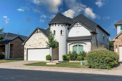 French country style house featuring stone siding, a shingled roof, stucco siding, concrete driveway, and a garage