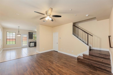 Unfurnished living room with wood finished floors