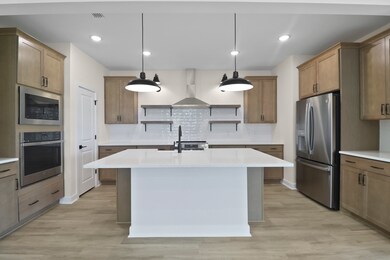 Kitchen with matte black pendant lighting