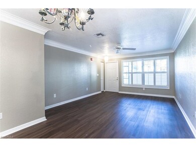 Front Room - plantation shutters, crown molding, new floors