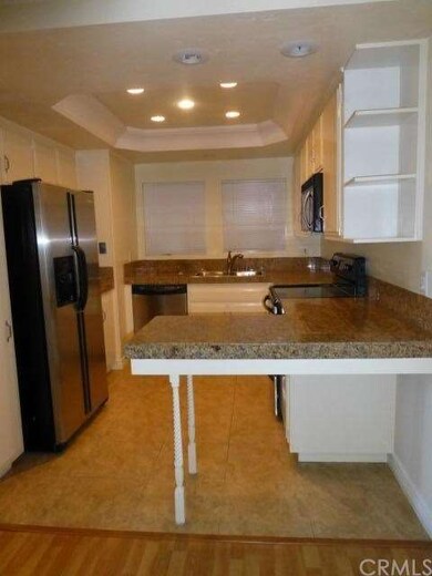 VIEW FROM DINING AREA TO REMODELED KITCHEN