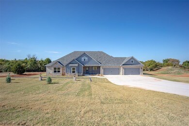 Craftsman-style home with a garage and a front law