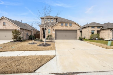 View of front of home featuring concrete driveway,
