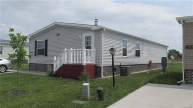 Front and side view with entrance to mud room