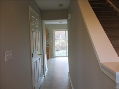 Hall from entrance to kitchen, powder room on your