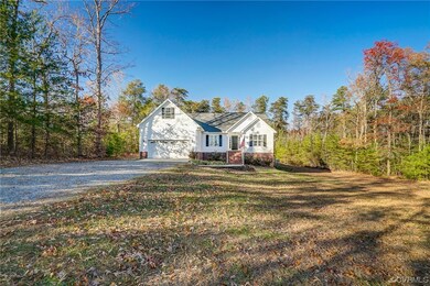 View of front of property featuring a garage and a
